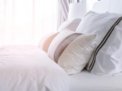 image of a white bed in the morning